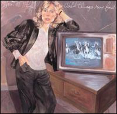 the album cover for Joni Mitchell - Wild Things Run Fast
