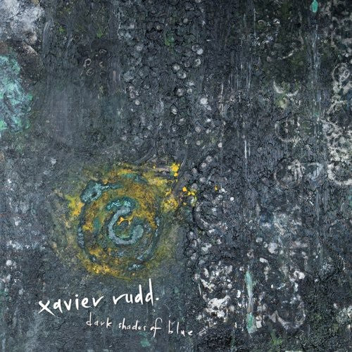 the album cover for Xavier Rudd - Dark Shades of Blue