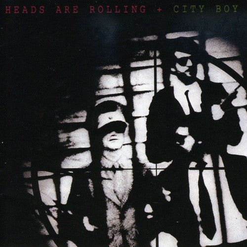 the album cover for City Boy - Heads Are Rolling