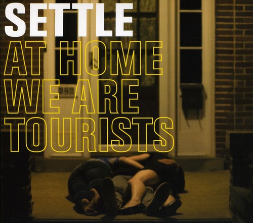 the album cover for Settle - At Home We Are Tourists