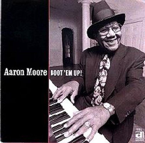 the album cover for Aaron Moore - Boot Em Up