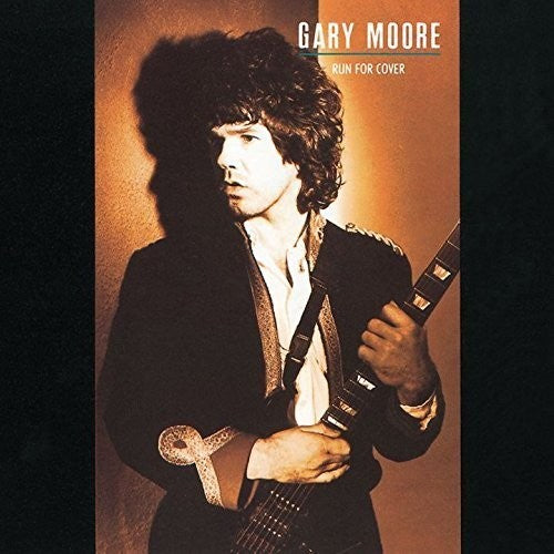 the album cover for Gary Moore - Run for Cover