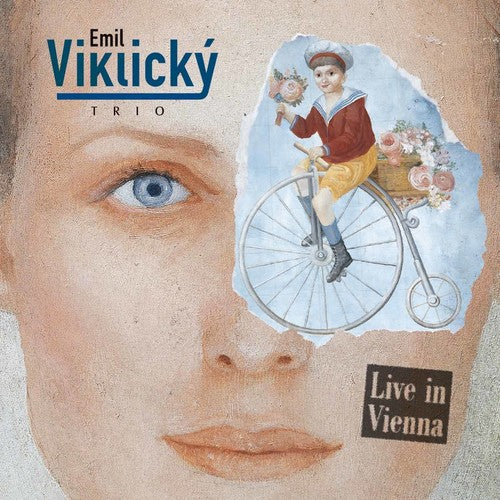 the album cover for Emil Viklický Trio - Live in Vienna