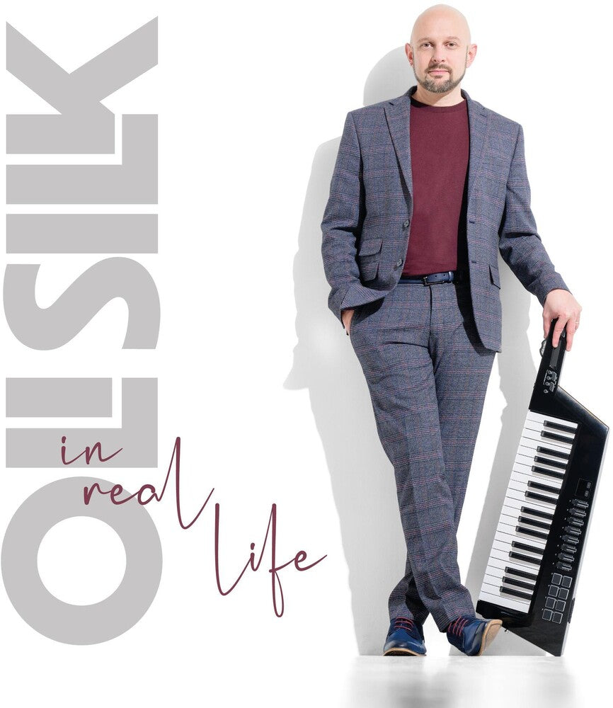 the album cover for Oli Silk - In Real Life