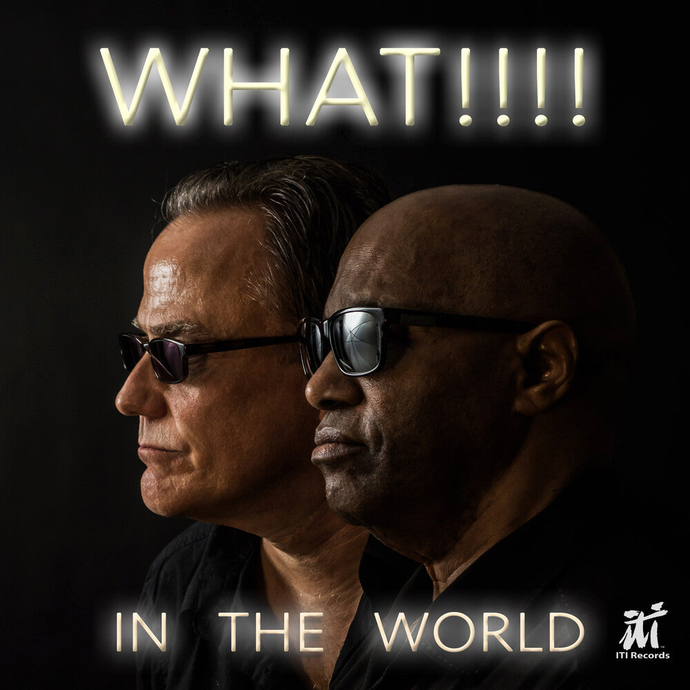 the album cover for What!!!! - In The World