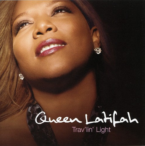 the album cover for Queen Latifah - Trav'lin' Light