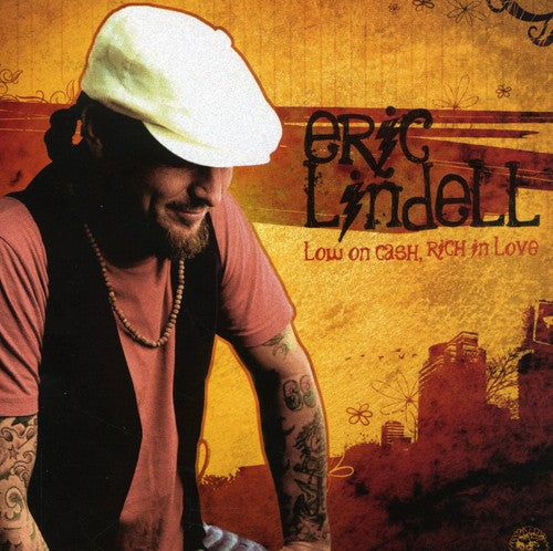 the album cover for Eric Lindell - Low On Cash, Rich In Love
