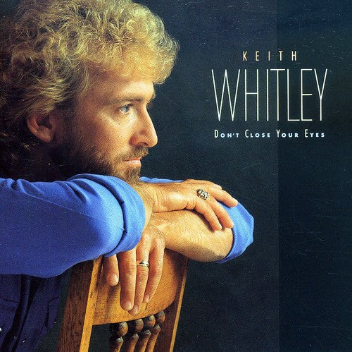 the album cover for Keith Whitley - Don't Close Your Eyes