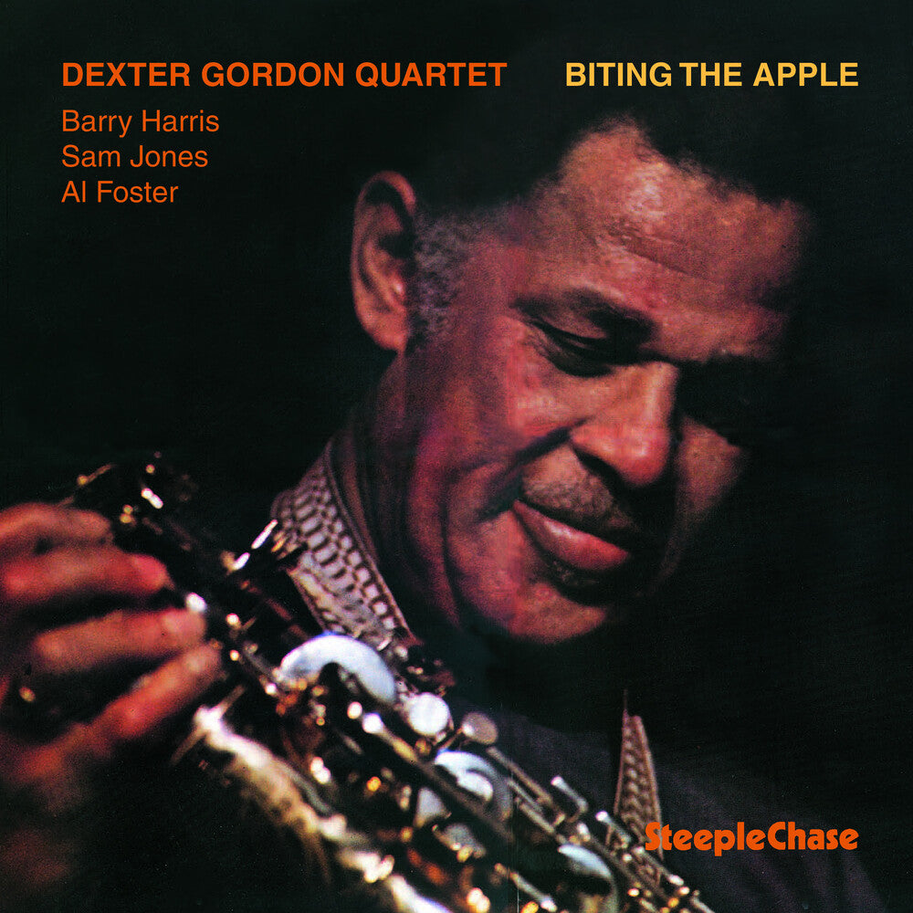 the album cover for The Piano Man - Biting the Apple