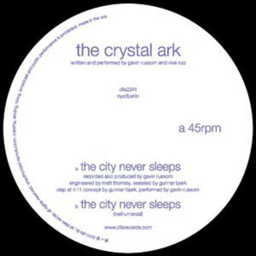 the album cover for Crystal Ark - The City Never Sleeps