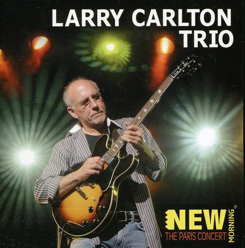 the album cover for Larry Carlton Trio - The Paris Concert