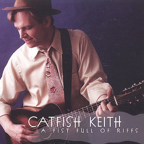 the album cover for Catfish Keith - A Fist Full Of Riffs