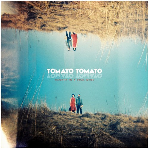 the album cover for Tomato/Tomato - Canary In A Coal Mine
