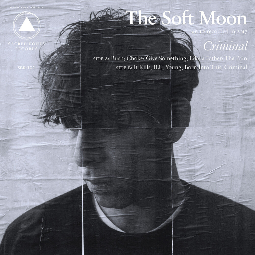 the album cover for The Soft Moon - Criminal: SB 15 Year Edition [Yellow & Black Swirl LP]