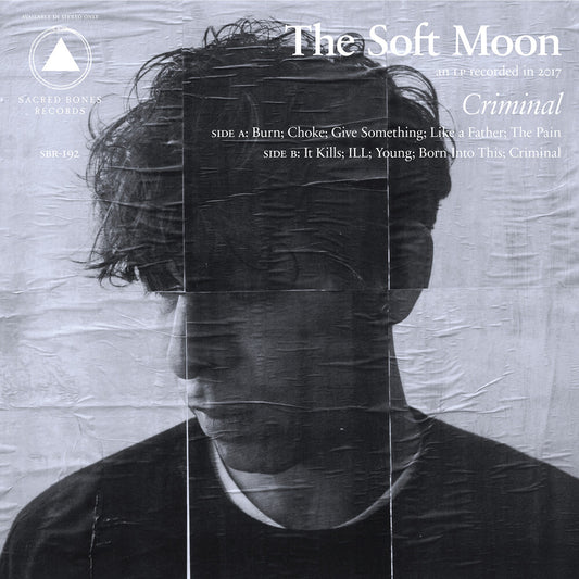 the album cover for The Soft Moon - Criminal: SB 15 Year Edition [Yellow & Black Swirl LP]