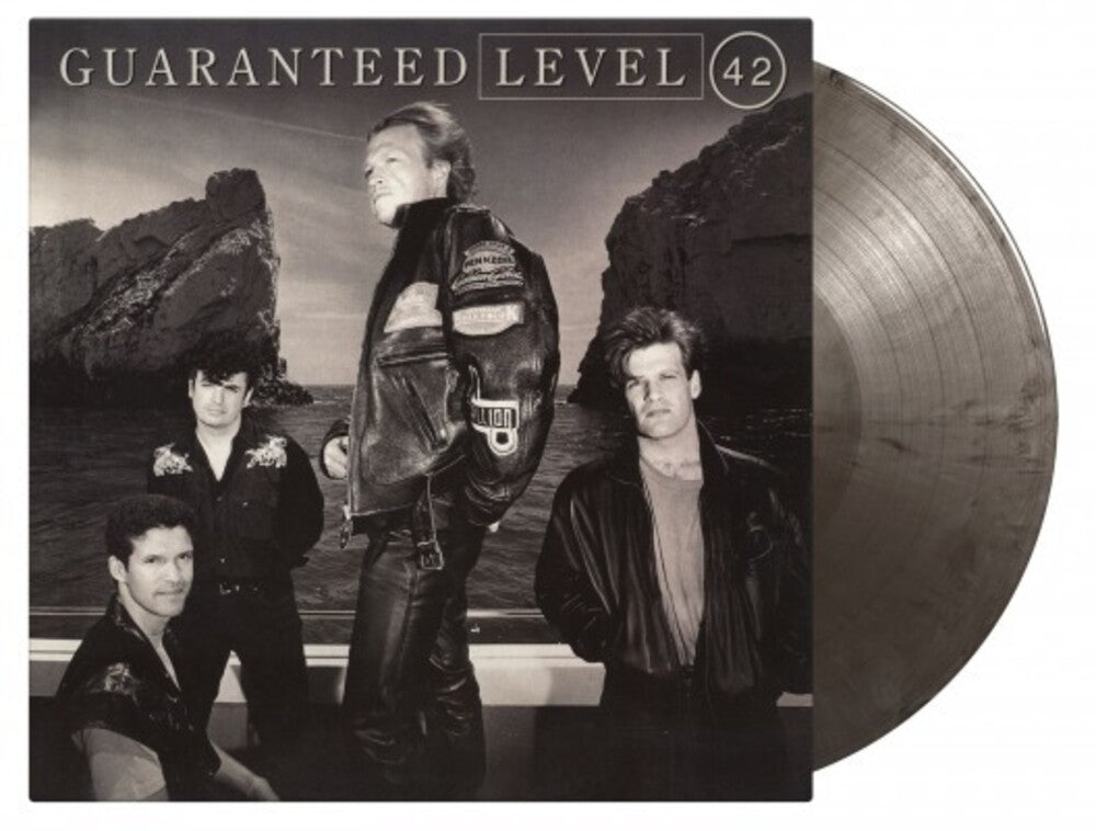 the album cover for Level 42 - Guaranteed - Limited Expanded, 180-Gram Silver & Black Marble Colored Vinyl with Bonus Tracks