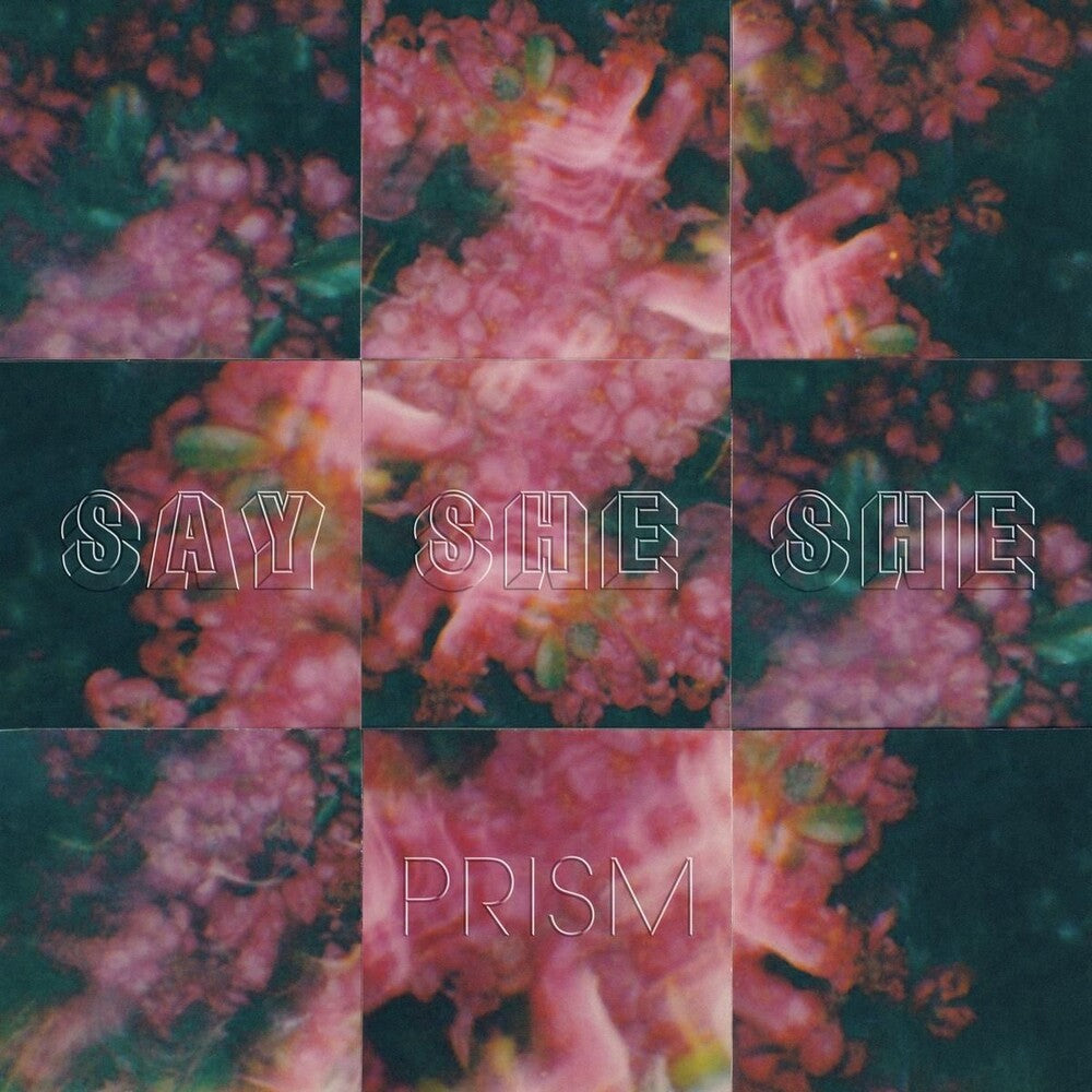 the album cover for Say She She - Prism - Natural W/Black Swirl [Colored Vinyl]