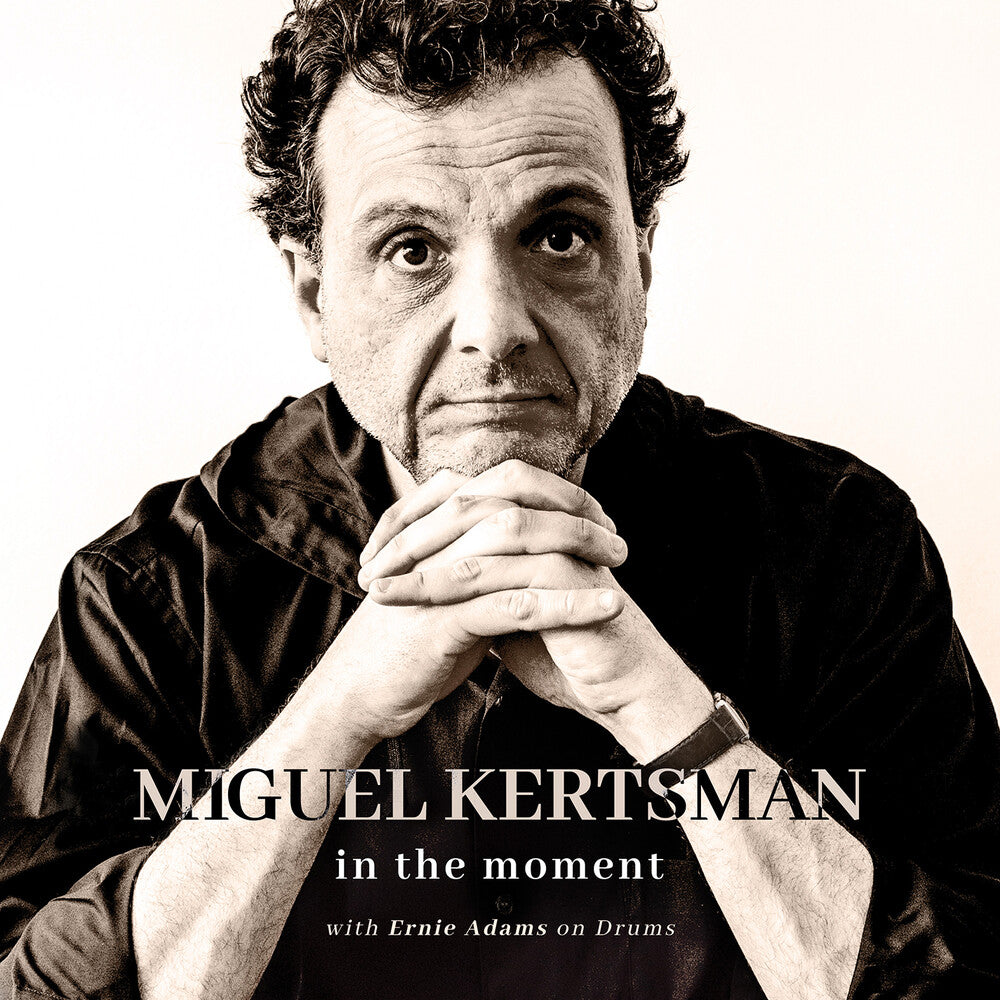 the album cover for Kertsman / Adams - In The Moment
