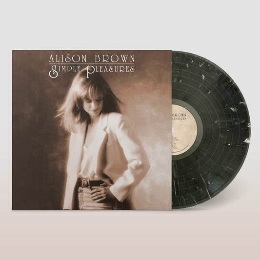 the album cover for Alison Brown - Simple Pleasures (Remixed And Remastered) [Black & White Swirl]