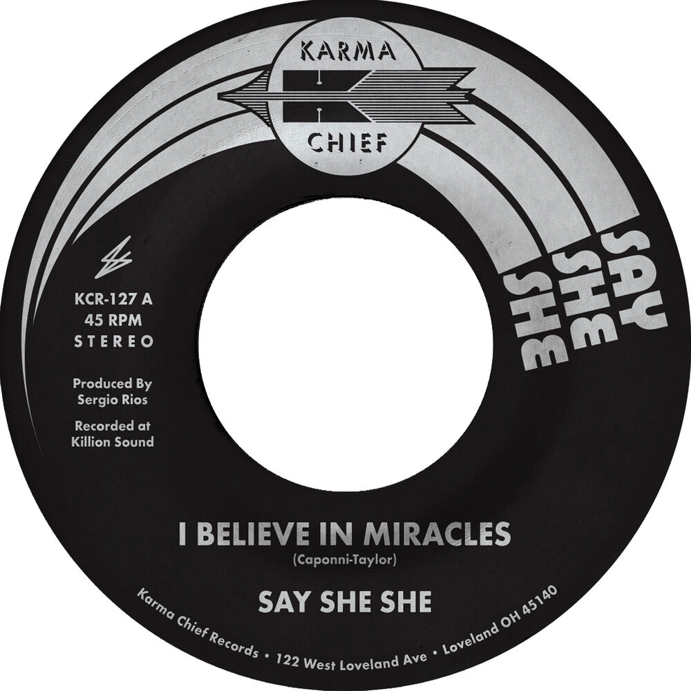 the album cover for Say She She - I Believe In Miracles / C'est Si Bon
