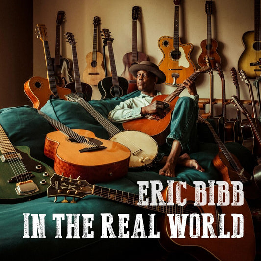 the album cover for Eric Bibb - In The Real World