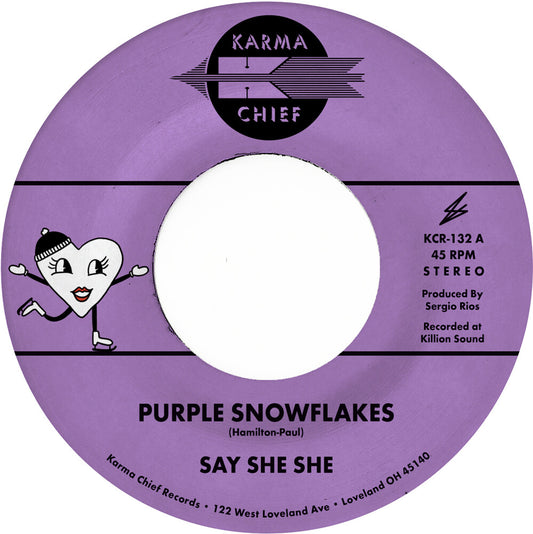 the album cover for Say She She - Purple Snowflakes / This Wintertime