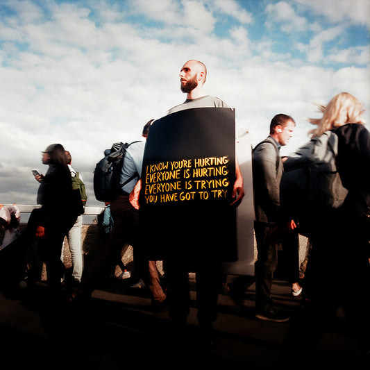 the album cover for Joshua Idehen - I Know You’re Hurting, Everyone Is Hurting, Everyone Is Trying, You Have Got To Try [Transparent Yellow LP]