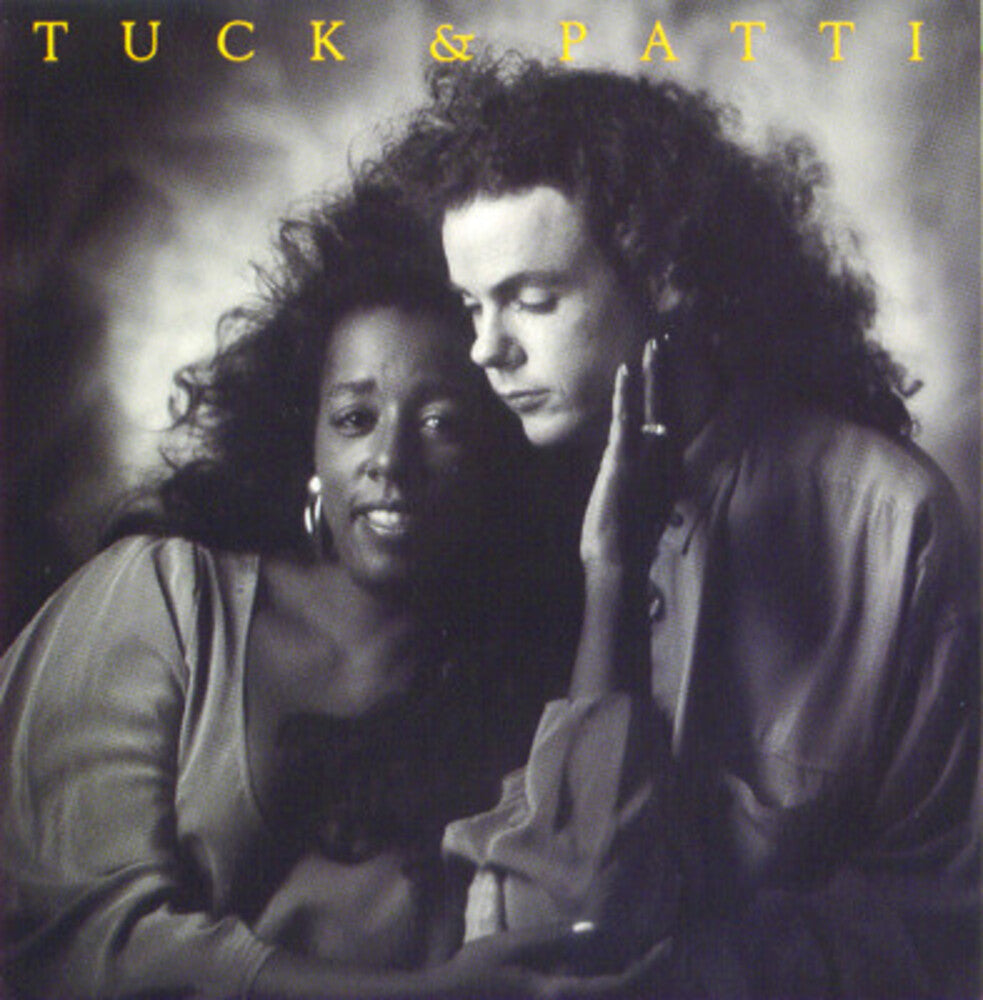 the album cover for Tuck & Patti - Love Warriors
