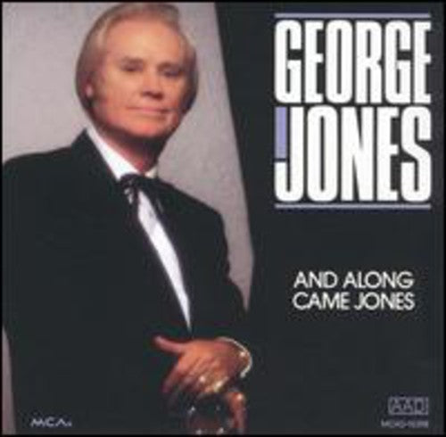 the album cover for George Jones - And Along Came Jones