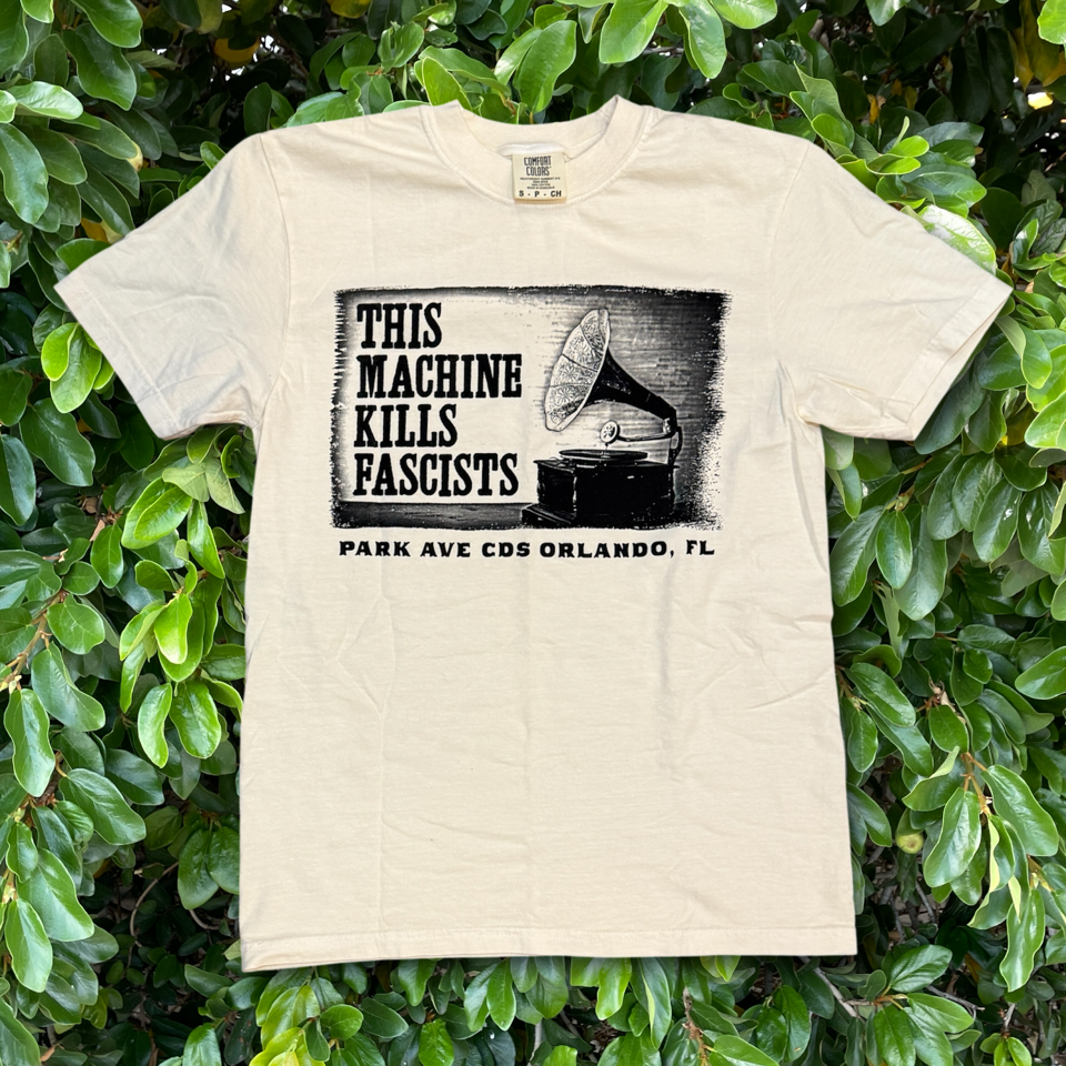 a shirt with a picture of a grammophone reading "this machine kills fascists / park ave cds orlando FL"