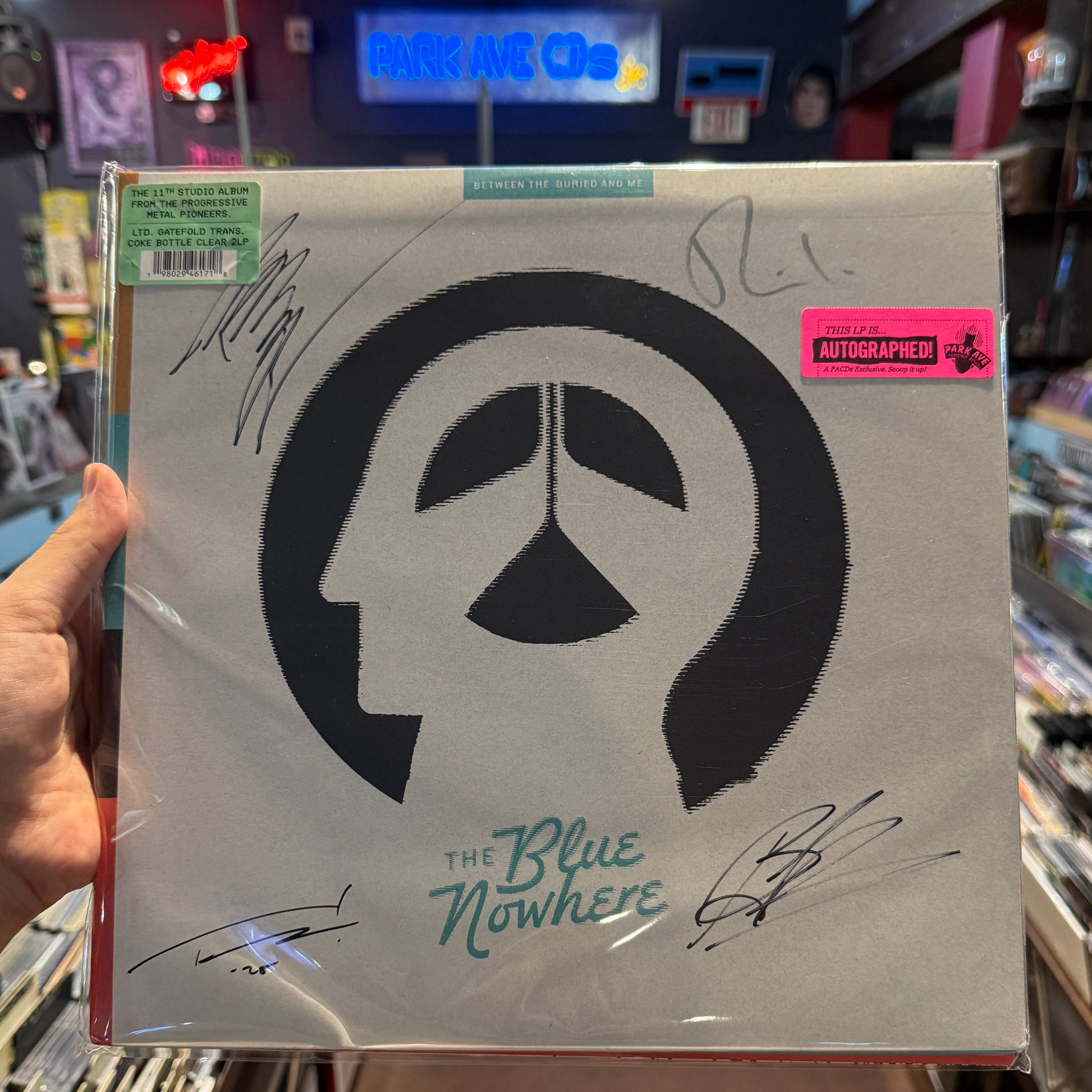 Signed vinyl copy of Between The Buried And Me - The Blue Nowhere Coke Bottle Clear 2LP