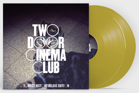 product mockup of two door cinema club - tourist history 15th anniversary deluxe 2lp gold vinyl